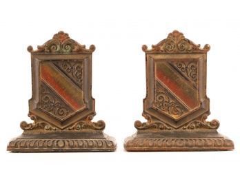 PAIR OF COLD PAINTED ARMORIAL CAST IRON BOOKENDS