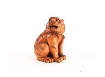 FINE OJIME CARVING OF A YOUNG TIGER