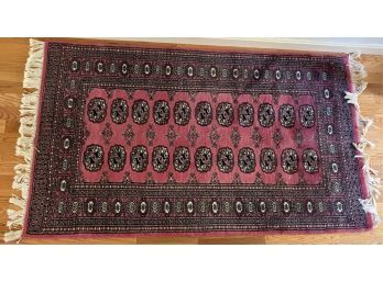 HAND KNOTTED BOKHARA AREA RUG IN CORAL