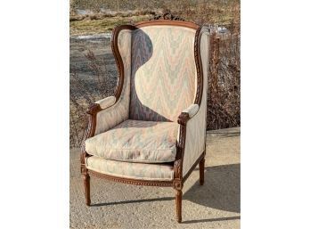 CARVED FRENCH UPHOLSTERED ARMCHAIR