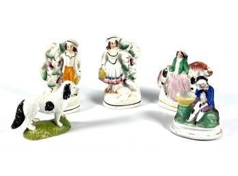 (4) STAFFORDSHIRE FIGURINES and a BISQUE DOG