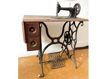 ANTIQUE SEWING MACHINE IN STAND