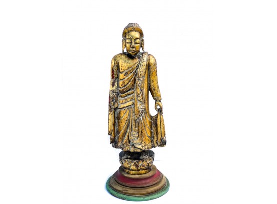 CARVED AND PAINTED GILT BUDDHA ON STAND