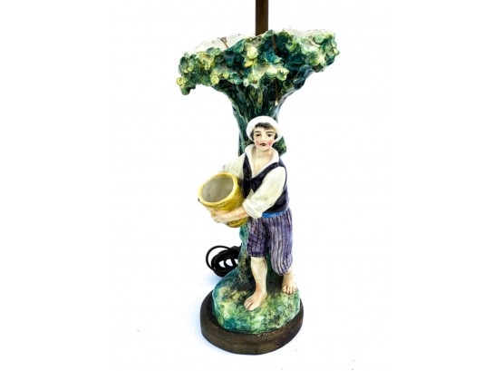 STAFFORDSHIRE LAMP BASE OF BOY WITH BASKET