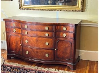 SERPENTINE MAHOGANY SIDEBOARD W CARVED DECORATION