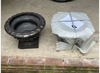 PAIR OF DECORATIVE IRON-FINISHED PLASTER URNS