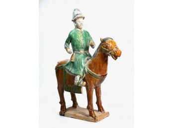 CHINESE TOMB FIGURE OF A WARRIOR ON HORSEBACK