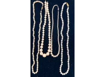 (4) STRANDS OF CHAMPAGNE COLORED FAUX PEARLS