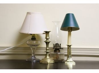 (2) GLASS FLUID LAMPS and (2) BRASS CANDLESTICKS
