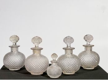 SET (4) PRESSED GLASS DECANTERS w CUT STOPPERS