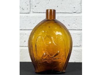 CLEVENGER BROS AMBER GLASS BOTTLE with EAGLE