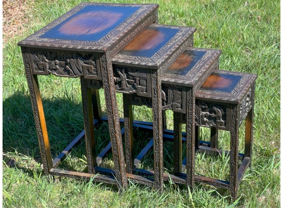HEAVILY CARVED (4) PIECE CHINESE NESTING TABLES