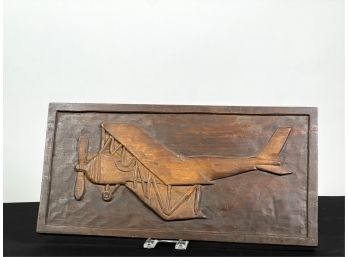 WALNUT RELIEF CARVING OF EARLY BIPLANE