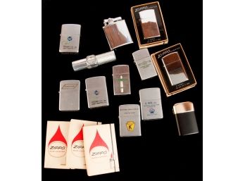 ASSORTMENT OF ZIPPOS LIGHTERS & ACCUTREMENTS