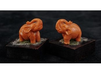 PAIR OF MINIATURE HAND-CARVED CORAL ELEPHANTS