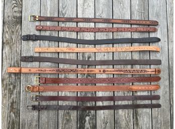 GROUP OF TOOLED LEATHER BELT BUCKELS