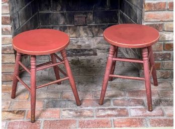 PAIR OF TURNED LEG LOW STOOLS IN RED PAINT