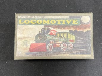 61. Tin Windup Locomotive Toy