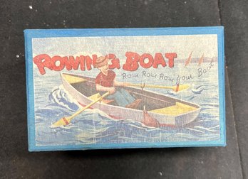 62. Tin Windup Man In Row Boat Toy