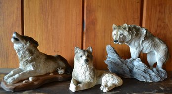 Two Living Stone Wolf Figurines And One More Wolf