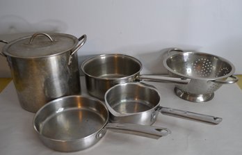 Assortment Of Stainless Steel Pots Pans And Collander
