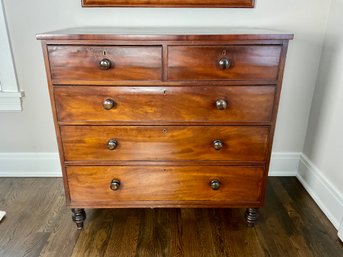 A Chest Of Drawers With Oversized Pulls