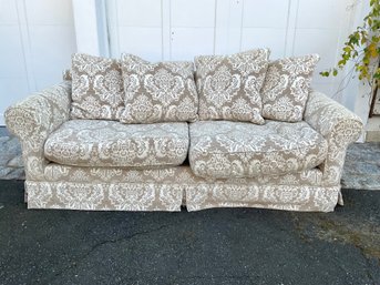An Upholstered Damask Sofa