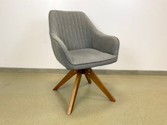 An Upholstered Mid Century Style Swivel Desk Chair