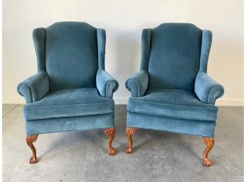 A Pair Of Upholstered Wingback Chairs