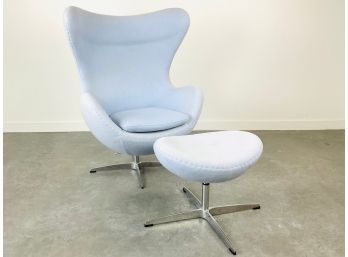A Swivel Egg Chair With Ottoman