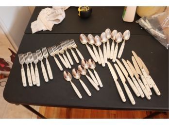 Stainless Steel And White Handled Flatware Set