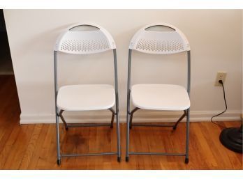 Pair Of White Plastic Folding Chairs