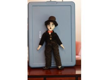 A CHARLIE CHAPLIN PORCELAIN DOLL RELATING TO THE STAGE PRODUCTION 'CHAPLIN'