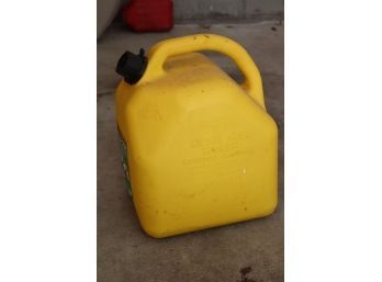 Yellow 5 Gallon Fuel Can With Gas In It
