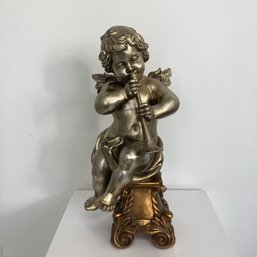 Sculpture-Sitting Cherub  Playing Horn Cira 1960