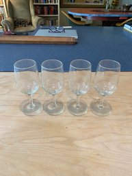 A Set Of Four Clear Glass Stemware