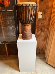 A Djembe Rope-tuned Skin-covered Goblet Drum  With White MDF Laminated Pedestal
