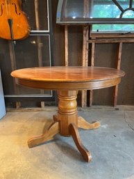 A Dutch Colonial Styled Round Pedestal Table (With Leaf)