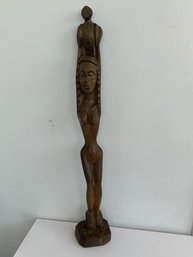 Wooden Haitian Sculpture Of Nude Woman Holding Bird Over Her Head