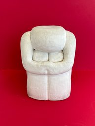 White Plaster Sculpture Of Person Sitting
