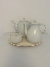 A Grouping Of White China Teapot, Coffee Pot, (Made In Germany), Sugar Bowl, & Plate