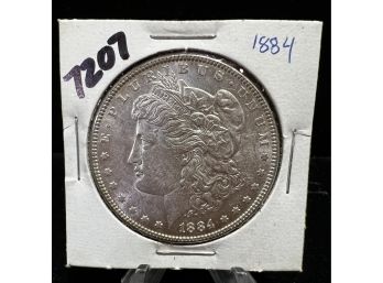 1884 Morgan Silver Dollar Uncirculated - Rainbow Toning Reverse