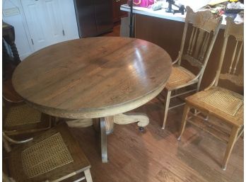 Antique Pedestal Table W/ 4 Cane Seated Chairs