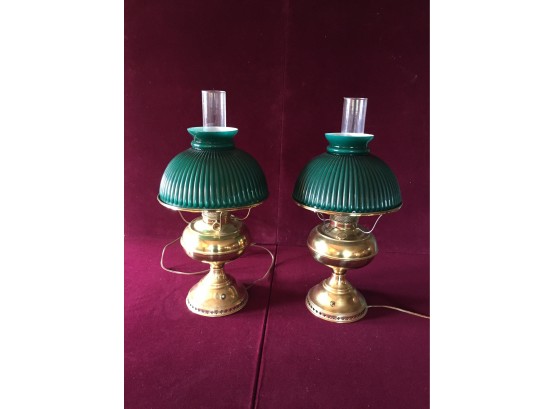 A Pair Of Vintage Brass Lamps With Glass Shades