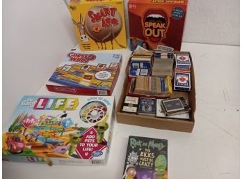 Assortment Of Board Games Including Speak Out, Life, And More