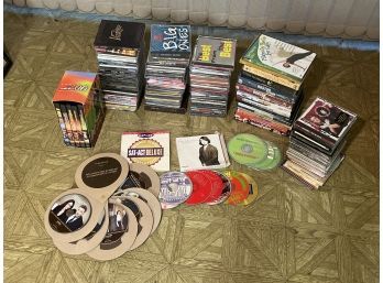 Large Grouping Of CDs And DVDs