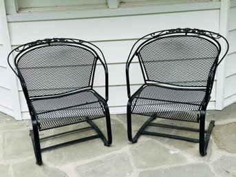 A Pair Of Wrought Iron Patio Armchairs