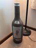 Lamp And Oversized Wine Bottle Decor