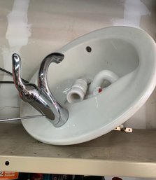 Bathroom Sink With Chrome Faucet And Plumbing
