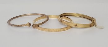 Vintage Gold Tone Bracelets Including Monet And Frierich Camper With Purple Stones